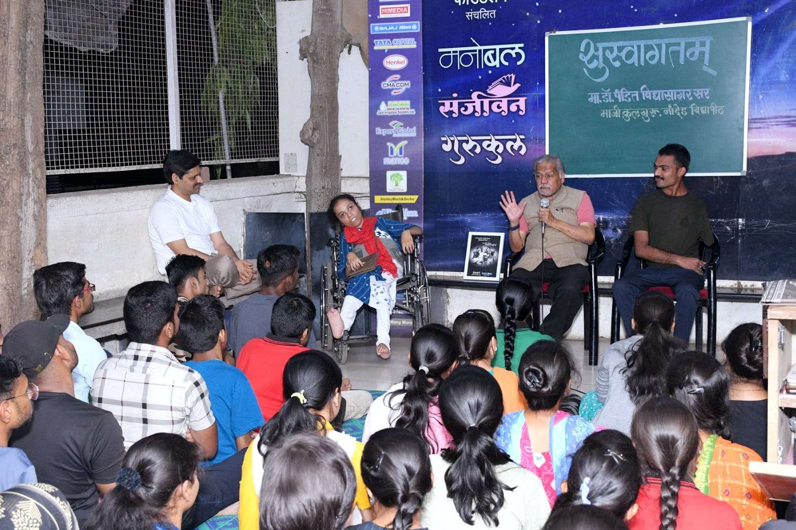 During a goodwill visit, Dr. Pandit Vidyasagar, the ex-Vice Chancellor of Nanded University, interacted with students at the Deepastambh Morale Project.