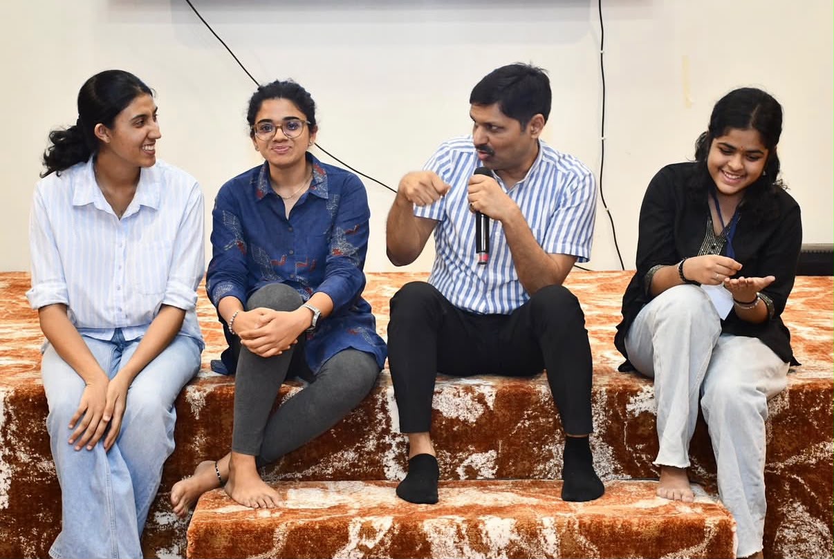 Deepstambh volunteers sitting together and chatting.