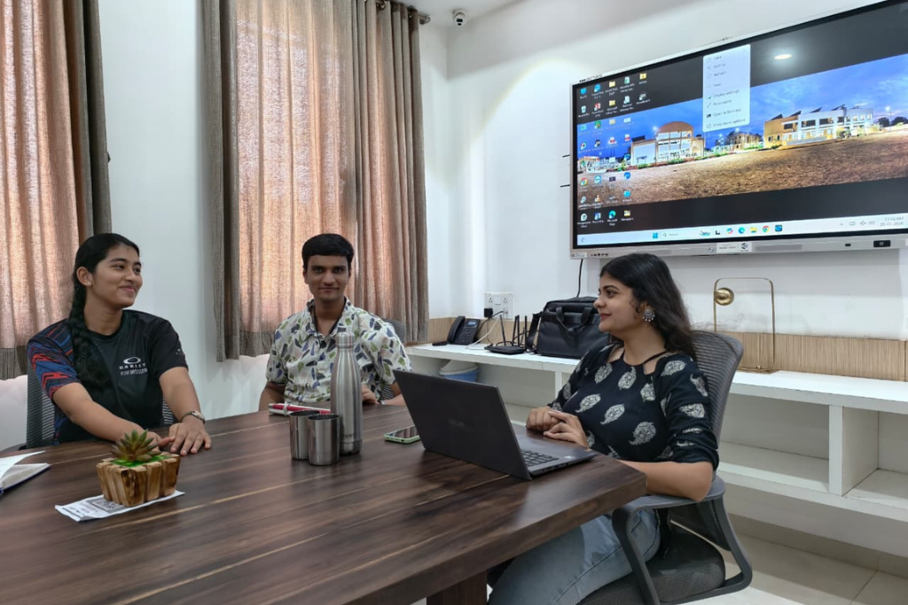 Deepstambh volunteers meeting around a table.